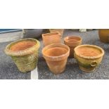 Collection of terracotta garden pots, two with moulded relief, one tapered rectangular and two