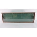 Wooden display case with glazed top, 106cm x 33cm x 9cm