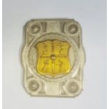 Cricket interest: Stamped and embossed metal buckle with shield representing four players, 6.5cm x
