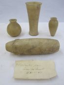 Four ancient Egyptian alabaster vessels with note '4 alabaster jars from the desert 23-1-47' (4)