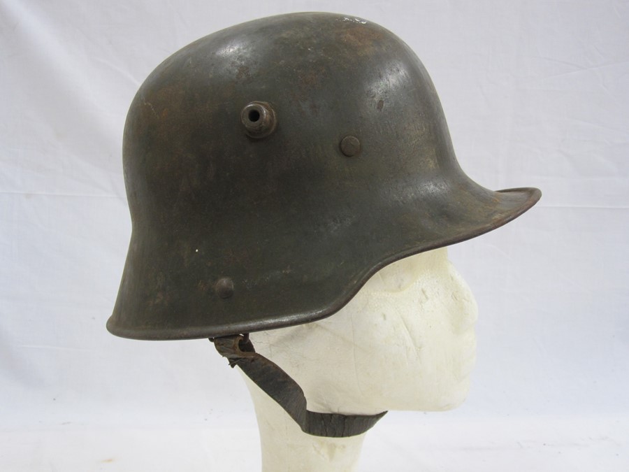 WWI German M16 helmet with leather liner and chin strapCondition ReportPlease see additional image - Image 2 of 3