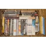 Militairia, four boxes of books and DVDs on the subject of war, including WWII, to include