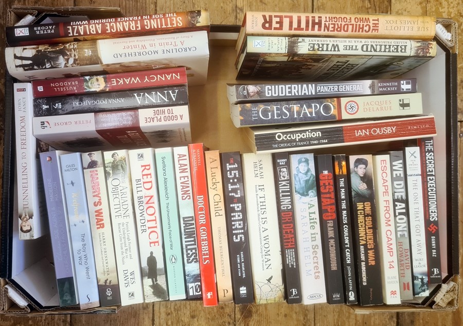 Militaria, three boxes of books and DVDs on the subject of war, to include Burt & Leasor "The One