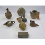 A quantity of ancient pottery vessels, first Millennium BC, some with tickets attached  These