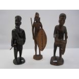 Carved Masai figure with his kill, 30cm high, a Kenyan carved man with rooster, 30cm high and an