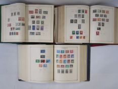 Three part-filled albums of World stamps (3)