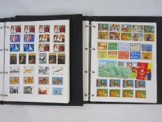 Two albums of GB Queen Elizabeth II mostly decimal mint stamps (2)