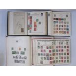 Four albums of sparsely filled stamps of the World, one envelope of mostly loose stamps (5)