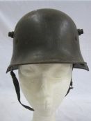 WWI German M16 helmet with leather liner and chin strapCondition ReportPlease see additional image