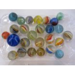 Small quantity of assorted sized marbles (26)