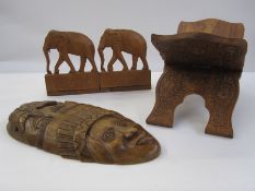 Pair of carved African elephant bookends, a carved book stand and a mask with palm trees (4)