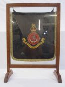 20th century oak firescreen with military hanging 'The Queen's Own Royal West Kent Regiment', 76cm