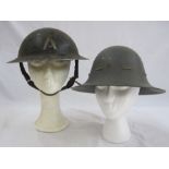 WWII Brodie style helmet used by the Ambulance Service together with WWII Civil Defence helmet