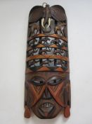 African mask with carved animals of elephant, giraffe, lions, 40cm long