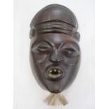 Carved African mask, early 20th century, 18cm long approx.