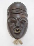 Carved African mask, early 20th century, 18cm long approx.