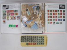 One bag of stamps, mostly on paper, two albums with a few stamps and a damaged enveloped franked