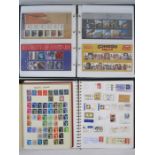 An album of mint decimal stamps presentation pack, an album of miscellaneous Worldwide cut-out