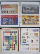 An album of mint decimal stamps presentation pack, an album of miscellaneous Worldwide cut-out