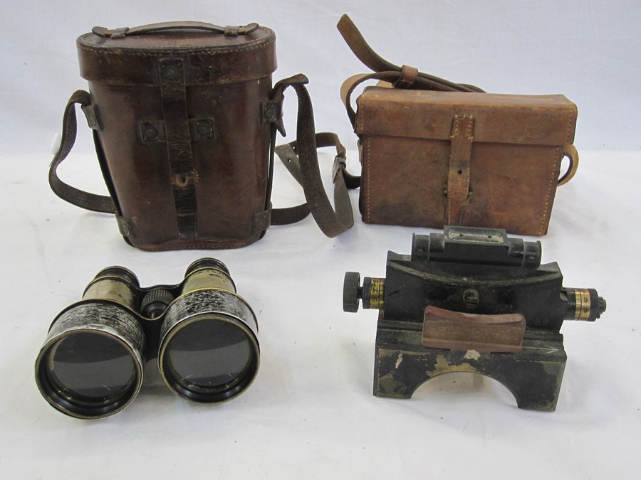 WWI era binoculars in leather case stamped with broad OA together with artillery clinometer