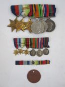 Lot Withdrawn: WWII Long Service and Good Conduct Medal group of six with miniatures and dog tag,