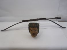 Indonesian bow and arrow from an Old Tale of the Indonesian Theatre and an Indonesian dancer's mask