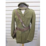 WWII Captain's uniform with badges and leather Sam Brown, officer's cap with Lincolnshire Regiment