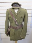 WWII Captain's uniform with badges and leather Sam Brown, officer's cap with Lincolnshire Regiment