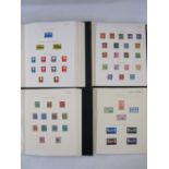 Four Plymouth stamp albums in slipcases of all World material mostly mounted mint and used (4)