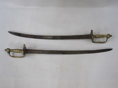 Pair of brass handled swords with reeded grip and heart shaped guard (unmarked)