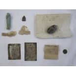 Various items in envelopes to include an 'Egyptian charm from neck of mummy', two 'votive offering
