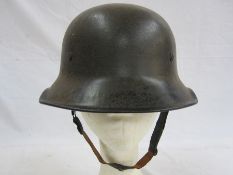 WWII German police helmet with canvas inner and leather chin strapCondition ReportPlease se