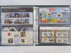 One album of modern GB presentation stamp packs  (1)