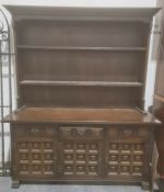 20th century dresser with shelves above three drawers, three cupboard doors, on plinth base, 157cm x