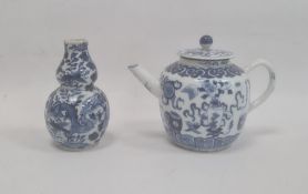 Chinese porcelain teapot, bulbous and decorated in blue with precious objects, 11cm high (repaired
