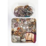 Assorted costume jewellery including glass beads, brooches, etc