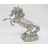 Cast metal model of rearing horse on rocky base, 33cm high