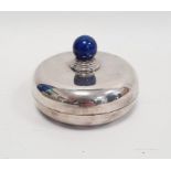 A 20th century silver coloured metal circular lidded trinket dish, with lapis lazuli style