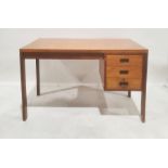 20th century Gordon Russell desk with three drawers, on rectangular section supports bearing label