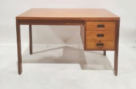 20th century Gordon Russell desk with three drawers, on rectangular section supports bearing label