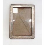 1940's silver-mounted rectangular picture frame, relief decorated to edge, Birmingham 1944, maker'
