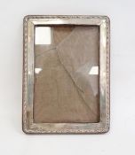 1940's silver-mounted rectangular picture frame, relief decorated to edge, Birmingham 1944, maker'