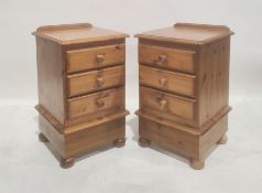 Pair 20th century pine bedside chests on ball feet (2)