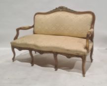 French-style settee with shell carving to top rail, foliate and yellow upholstered seat, back and