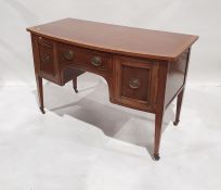 20th century mahogany bowfront Regency-style sideboard, the single drawer flanked by cupboard