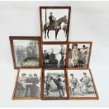 Set of seven early 20th century black and white photos of figures at a country show, some on