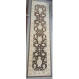 Modern Eastern-style brown ground rug with cream decoration, 303cm x 83cm