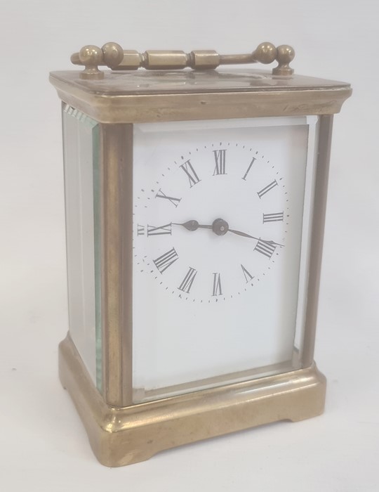 Brass and glass carriage clock with five brass sides, Roman numerals to the dial