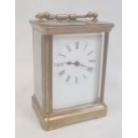 Brass and glass carriage clock with five brass sides, Roman numerals to the dial