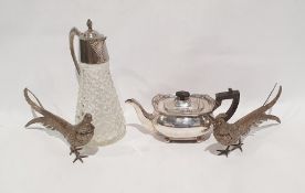 Glass and silver plated claret jug, a pair of silver-coloured metal pheasants and a teapot (4)